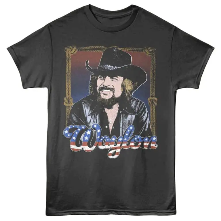 Vintage cowboy graphic t-shirt featuring a rugged cowboy face, black hat, leather jacket, and "Wagon" slogan.