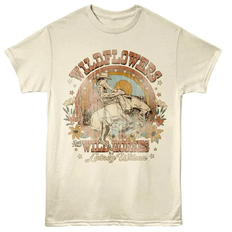 Vintage-inspired Wildflowers T-shirt featuring a cowboy riding a horse with floral accents.