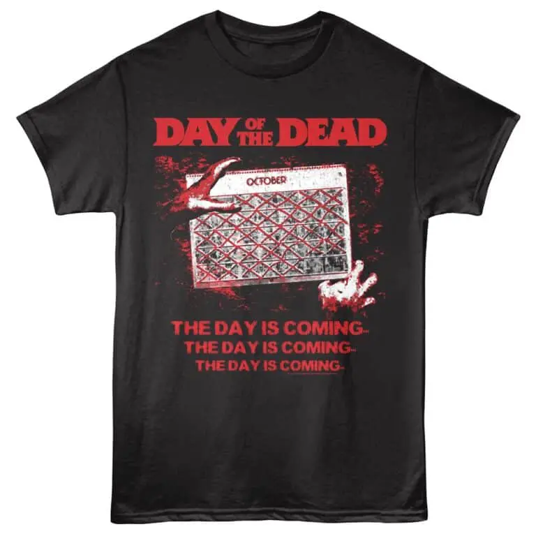 Black T-shirt with Day of the Dead-themed graphic and spooky zombie hand design.