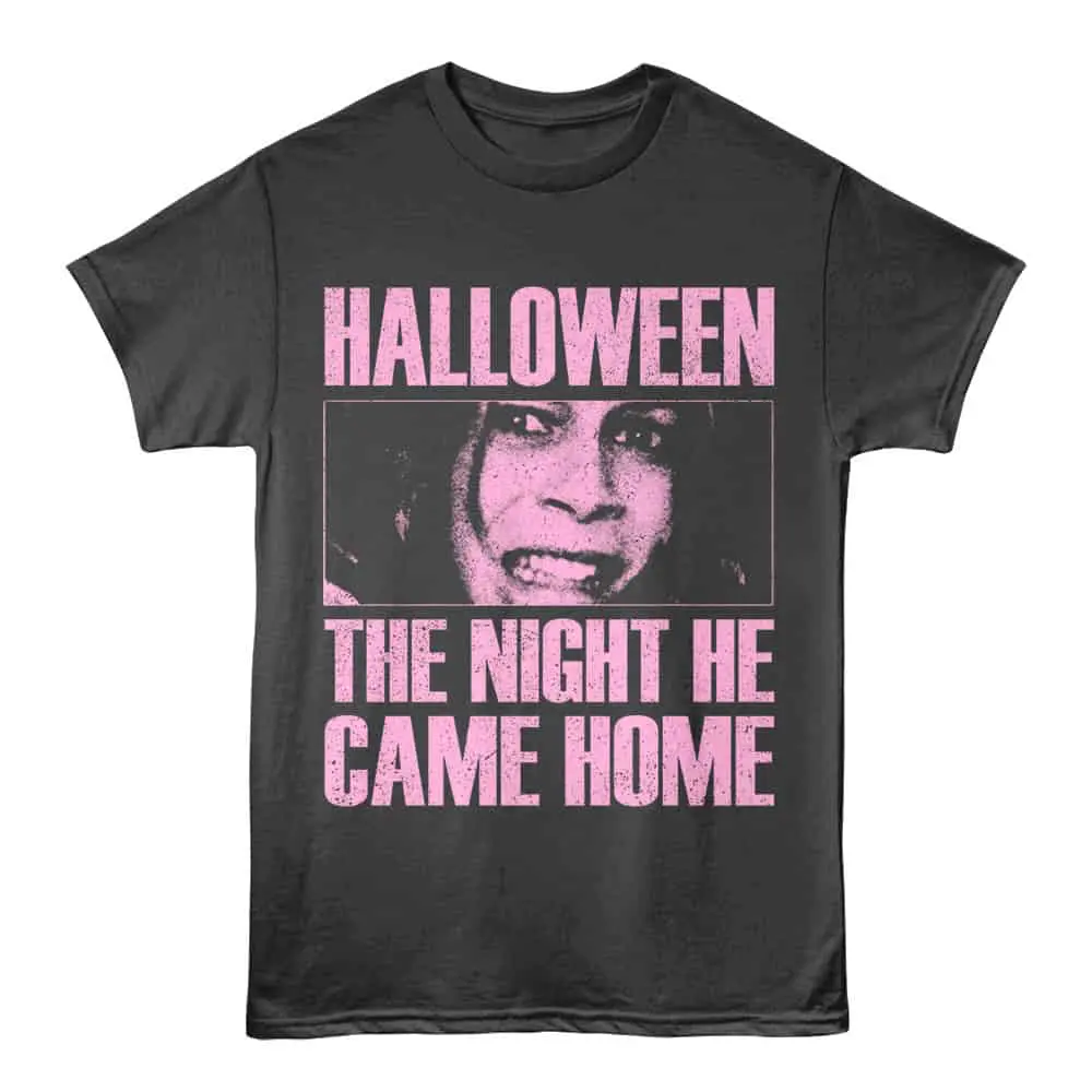 Graphic Halloween T-shirt with spooky face and pink text.