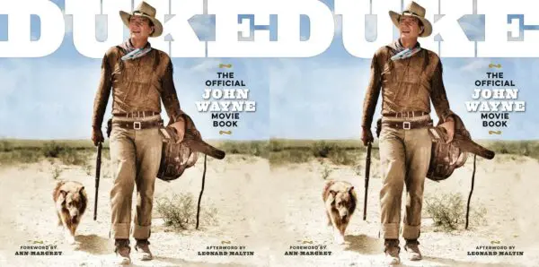 Vintage western movie poster featuring John Wayne with dog in desert landscape.