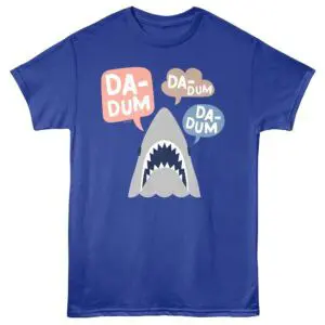 Bright blue T-shirt featuring a cartoon shark with speech bubbles saying "DADUM" for fun, trendy apparel.