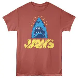 Bright blue shark head with sharp teeth, yellow "Jaws" text on distressed red background.