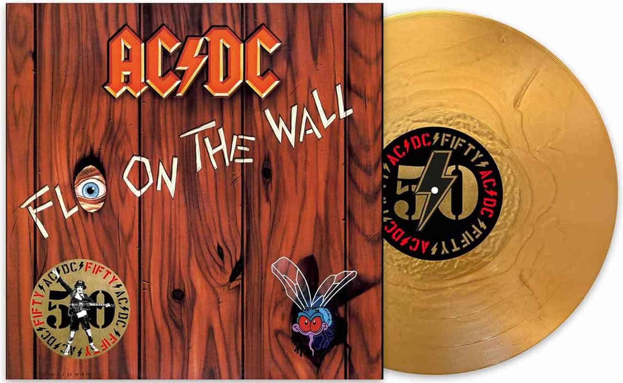 Gold-colored vinyl record with AC/DC logo and wood-themed album cover design.