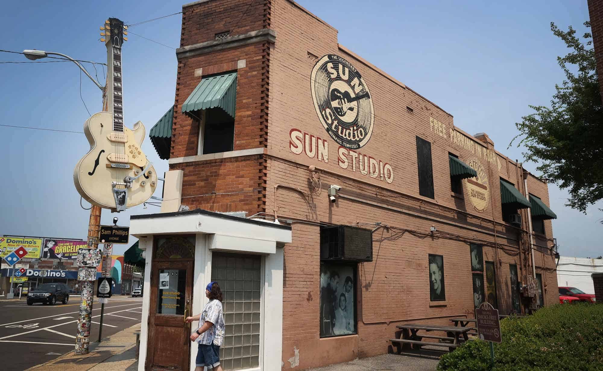 ALT: Historic Sun Studio in Memphis, TN with vintage sign, brick exterior and music memorabilia.