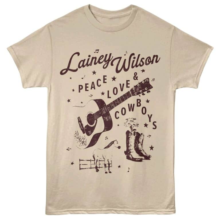Vintage-inspired Lainey Wilson Tee with guitar, cowboy boots, horse, and floral design.