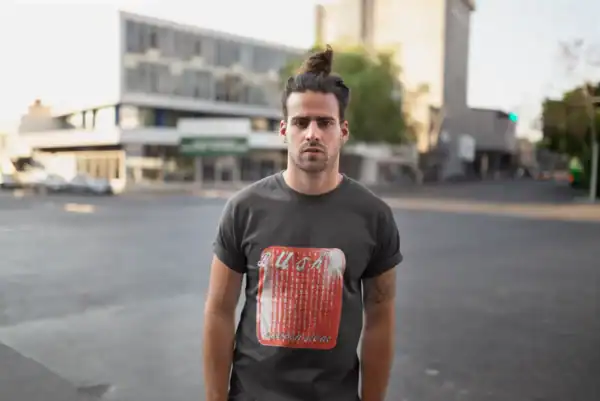 Young man wearing a vintage Black Lunch T-shirt on city street during daytime, urban fashion, casual style, streetwear, modern men's clothing.