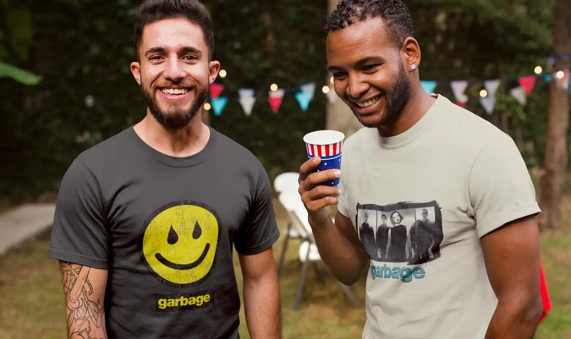 Two young men wearing vintage Garbage t-shirts at a party