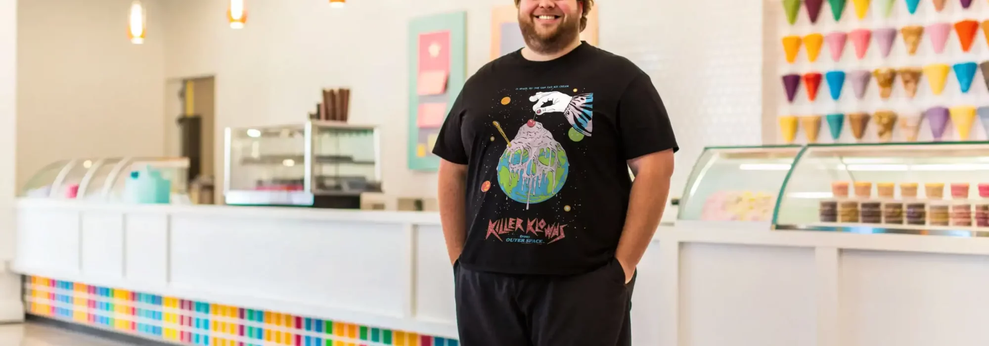 Vibrant ice cream shop interior with colorful decor and ice cream display.