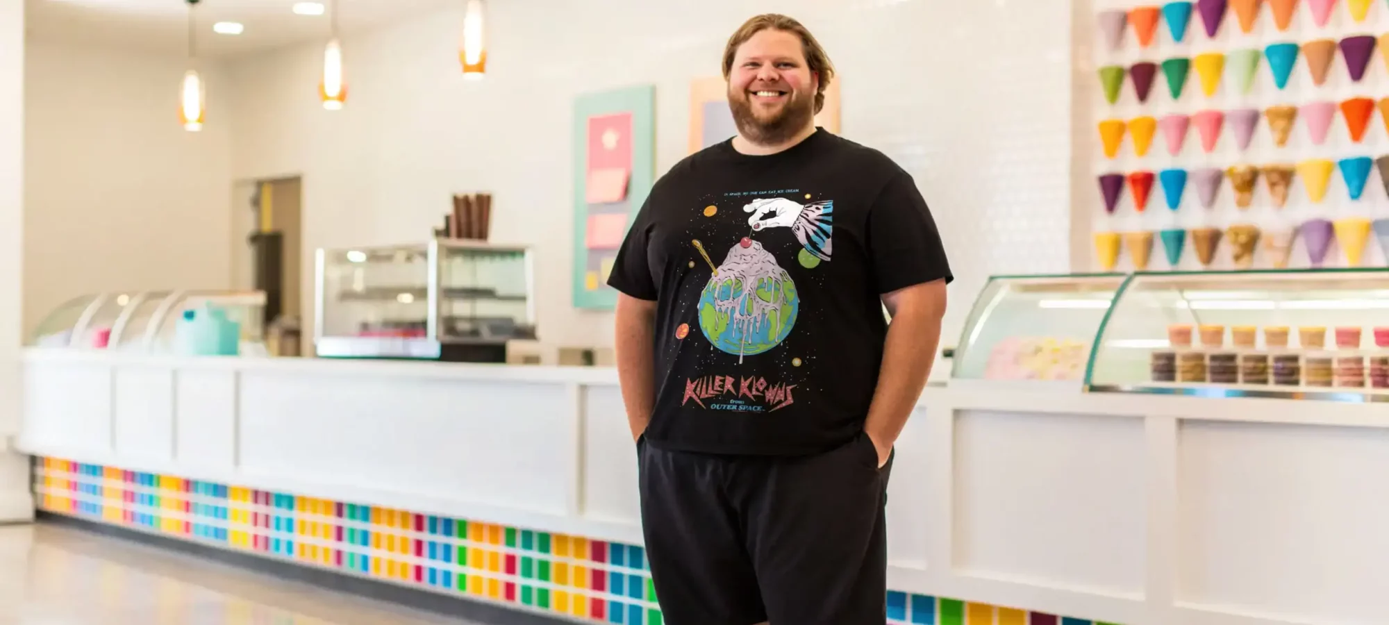 Vibrant ice cream shop interior with colorful decor and ice cream display.