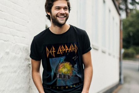 def-smiling-goth-dude-in-a-black-t-shirt-and-black-jea