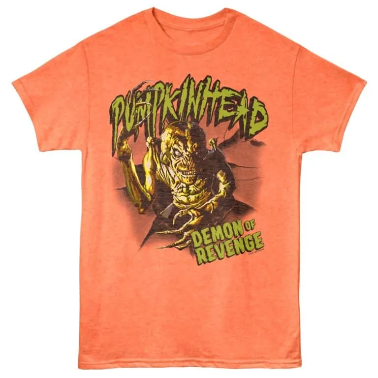 A vibrant orange graphic T-shirt featuring a monstrous demon illustration with bold text "Demon of Revenge" for horror and Halloween enthusiasts.