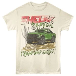 Vintage Shelby Raptor graphic tee featuring a green off-road truck, desert scene, and bold text design.
